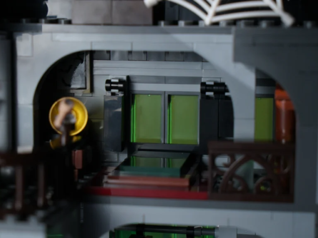 Victorian haunted manor construction model on a desktop