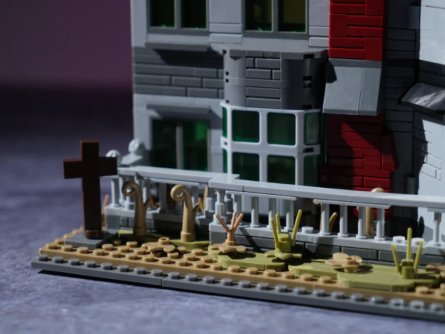 Haunted Victorian mansion with cross and abandoned garden