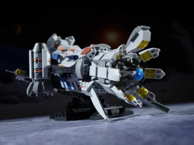 Black display stand supporting the CR006 spaceship building model