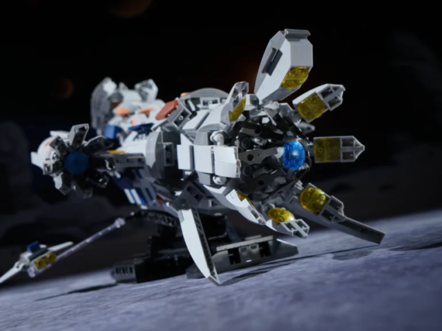 Parent and child building the CR006 deep-space cargo freighter set together