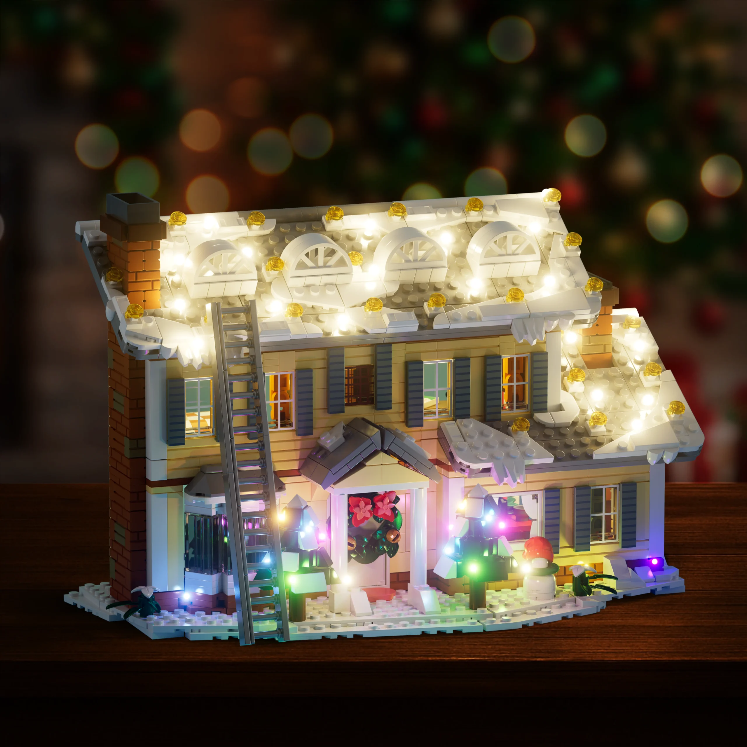 Snow-covered roof with holiday lights on the Christmas house model