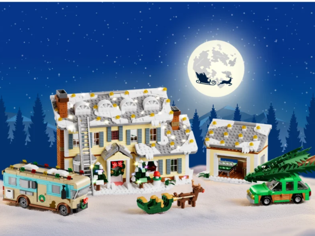 Light-up Christmas house model with warm interior windows